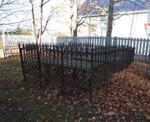 Gravemarkers enclosed by cast iron fence, Covenanter Church, Grand Pré, Nova Scotia, 2006.
; Heritage Division, NS Dept. of Tourism, Culture and Heritage, 2006