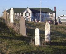 Photo view from Old Holy Trinity Parish Cemetery, looking east, facing Holy Trinity Primary and Elementary School, Torbay Road, Torbay, NL, 2006/05/10; L Maynard, HFNL, 2006