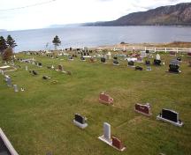 View of the cemetery with Conception Bay in the background. Photo taken 2006.; HFNL 2009