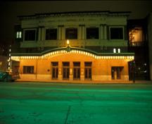 General nighttime view of Pantages Playhouse theatre, 1995.; Parks Canada/Parcs Canada, 1995.