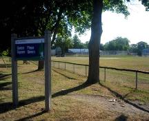 Image of Queen's Square showing signage and baseball field at the St. John Street side of the park; City of Fredericton