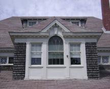 This photograph shows the palladian window in the central dormer and the pilasters that divide the openings, 2007; Town of St. Andrews