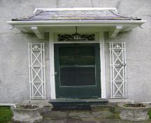 This photograph shows the entrance with shingled roof, 2007; Town of St. Andrews