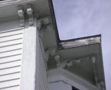 This photograph illustrates the decorative brackets and pendants under the eaves, 2008; Town of St. Andrews