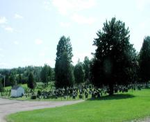 The cemetery viewed from the northeast with the charnel house on the left; Memramcook Valley Historical Society