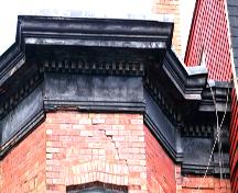 This image shows the building's cornice; City of Saint John, 2007