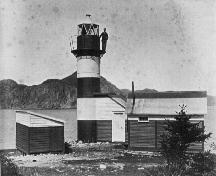 Rocky Point Light Station, circa1887, showing original attached structure and caretaker up by the light. ; Elliott Premises (Newman and Co. Photo Album) 2009