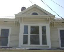 This photograph shows the centrally located pediment which crowns the upper storey bay window, 2008; Town of St. Andrews