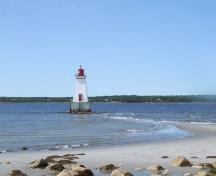 View of the Sandy Point Lighthouse, Shelburne, Nova Scotia, and the sand spit that it rests on.  It is only accessible by foot during lowtide.; Heritage Property Program, Nova Scotia Heritage Division, 2009