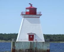The door of the Sandy Point Lighthhouse, Shelburne, Nova Scotia, faces the shore for emergency purposes.; Heritage Property Program, Nova Scotia Heritage Division, 2009