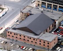 Aerial view of the armoury, showing its irregular plan and massing, consisting of two, two-storey blocks joined by a drill hall.; Regimental Museum.