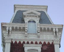 This photograph shows the top floor of the ornate tower with a Mansard roof; City of Saint John