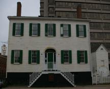 This photograph shows the contextual view of the house and the outbuilding; City of Saint John