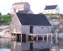 York Manuel Fish Shed and Store, fish store showing the dock and underpinning pilings, as well as the glacial rock upon which Peggy's Cove is built; Heritage Division, NS Dept. of Tourism, Culture and Heritage, 2008