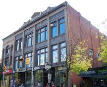The McSweeney Building, fronting the south side of Main Street, retains most of the original exterior details.; Moncton Museum