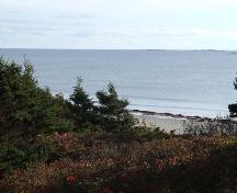 Clam Harbour Provincial Park looking out over the Atlantic Ocean through fir trees.; Heritage Division, NS Dept. of Tourism, Culture and Heritage, 2009.