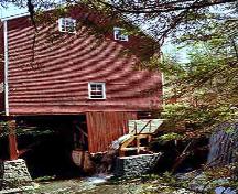 View of water wheel, building supports and a portion of dam, Balmoral Grist Mill, Balmoral Mills, NS, 2004.; Dept. of Tourism, Culture and Heritage, Province of NS, 2004