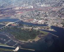 Aerial view of the Whitefish Island National Historic Site of Canada featuring its cover of dense bruch, 2001.; Agence Parcs Canada / Parks Canada Agency, G. Vandervlugt, H.06.644.09.01(08), 2001.