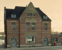 Façade of St. Stephen Post Office, showing its generous door and window trim, 1989.; Parks Canada Agency / Agence Parcs Canada, 1989.