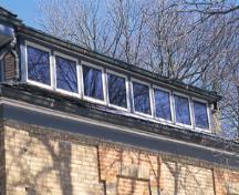View of the exterior of Homer Watson House / Doon School of Fine Arts, showing the clerestory windows and a monitor, which allow for soft, indirect light, 1995.; Parks Canada Agency / Agence Parcs Canada, J. Butterill, 1995.