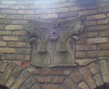Featured is one of the salvaged stone capitals.; City of London, Planning and Development Department, 2004.