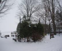 Of note are the mature trees and cemetery sign.; Martha Fallis, 2008.