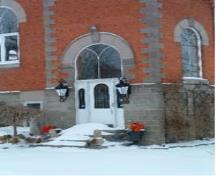 Featured is the entrance with stained glass transom.; Municipality of Huron East, 2008.