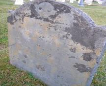 The Samuel Mack grave marker with a winged death's head image in the Old Port Medway Cemetery, Port Medway, NS.; NS Dept. of Tourism, Culture & Heritage, 2009