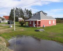 A northwest perspective view of the Little School Museum in its setting in the Town of Lockeport, NS.; NS Dept of Tourism, Culture & Heritage, 2009