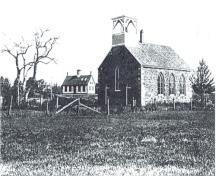 Historic image of St. Paul's Anglican Church with the original Grand Harbour School in the background. The school is across the brook. ; Grand Manan Archives