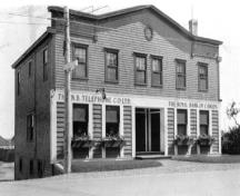 Photo de l’édifice en 1939, lorsqu’il logeait la Banque Royale du Canada ainsi que le N. B. Telephone Co. Ltd.; Private collection