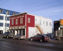 This image illustrates the overall form and massing of the Kingston Powell Building, in its corner location as seen from the southwest (2004).; City of Edmonton, 2004