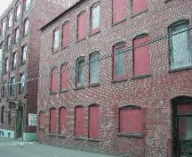This photograph shows the windows and the proximity of the building to the corner building to the south, 2004.; City of Saint John