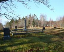 The Old Pioneer Cemetery Extension has terraced plots with beautiful old trees shading the cemetery; Grand Manan Historical Society