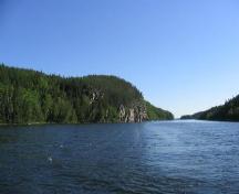 View of channel and an exposed rock face where some of the pictographs are located, 2004.; Government of Saskatchewan, Erin Ermel, 2004.