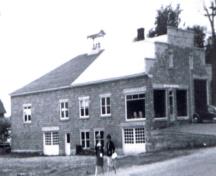 Picture of the building taken in the 1960's after it was purchased for use as the Town Hall; Doris E. Kennedy