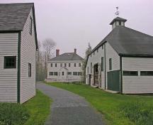 View of rear elevation of main house, barn (right) and carriage house (left), Uniacke House, Mount Uniacke, 2005.; Heritage Division, NS Dept. of Tourism, Culture and Heritage, 2005.