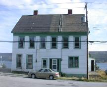 Exterior view of the front facade of the duplex at 161-163 Water Street, Harbour Grace, Newfoundland, taken summer 2004, prior to restoration.; HFNL 2005