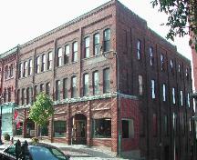 This is a contextual view of the building showing the front façade on Germain Street and the north façade on Grannan Street, 2004. ; City of Saint John