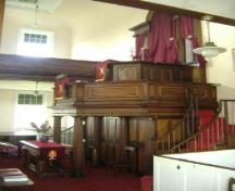 This photograph illustrates the mahogany pulpit, 2009; Town of St. Andrews