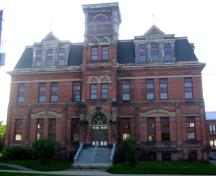The former York Street School, situated on the west side of York Street, is a massive three-storey brick structure; City of Fredericton