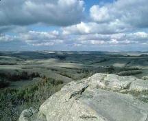 View of the surrounding landscape from the petroglyph outcrop, 1993.; Government of Saskatchewan, 1993.