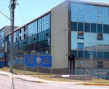 General view of the Trades Training Building, showing the use of durable, easy to maintain materials including glass, concrete block, reinforced concrete, and steel, 2005; CFB Esquimalt / BFC Esquimalt, 2005.
