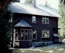 Rear view of the Superintendent's Residence, showing its two-storey structure with a one-storey frame bay addition on the rear, 1992.; Parks Canada Agency / Agence Parcs Canada, 1992.
