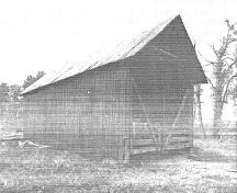 General view of the Hay Shed, showing the east and south façades, 1992.; Department of Public Works, AES, PC, WRO / Ministère des Travaux publics, SAG, PC, BRO, 1992.