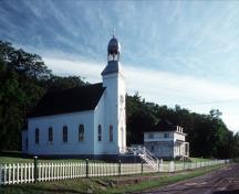General view of Building 48, showing the massing that consists of the small chapel with a pitched roof and the attached bell tower porch, circa 2004.; Parks Canada Agency / Agence Parcs Canada, circa / vers 2004.