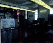Interior view of the Government of Canada Building, showing the mail sorting area, 1998.; Parks Canada Agency / Agence Parcs Canada, KAL, 1998.