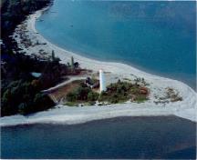 Aerial view of the Tower at Christian Island, showing its prominent position on a peninsula, 1990.; Canadian Coast Guard / Garde côtière canadienne, 1990.