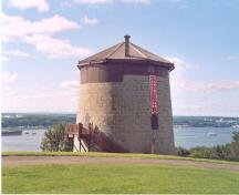 View of Martello Tower 1, showing the massive circular walls built of rubble masonry, 2003.; Parks Canada Agency/Agence Parcs Canada, 2003.