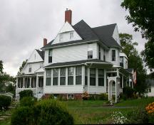 This image presents the building's picturesque qualities of the Queen Anne Revival style in a residential application.; PNB 2005